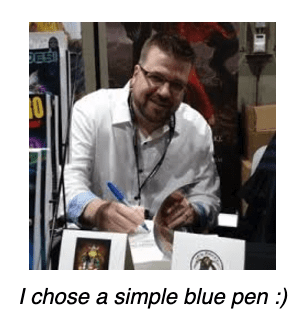 Drake signing books, with the caption "I chose a simple blue pen"
