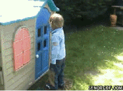 A child knocking on a playhouse door