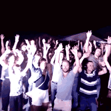 A crowd cheering at a party