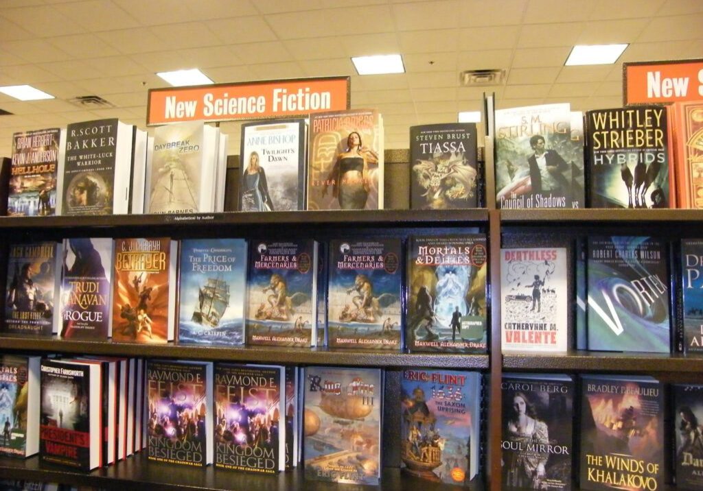 Drake's fantasy novels on a bookstore's new science fiction shelf