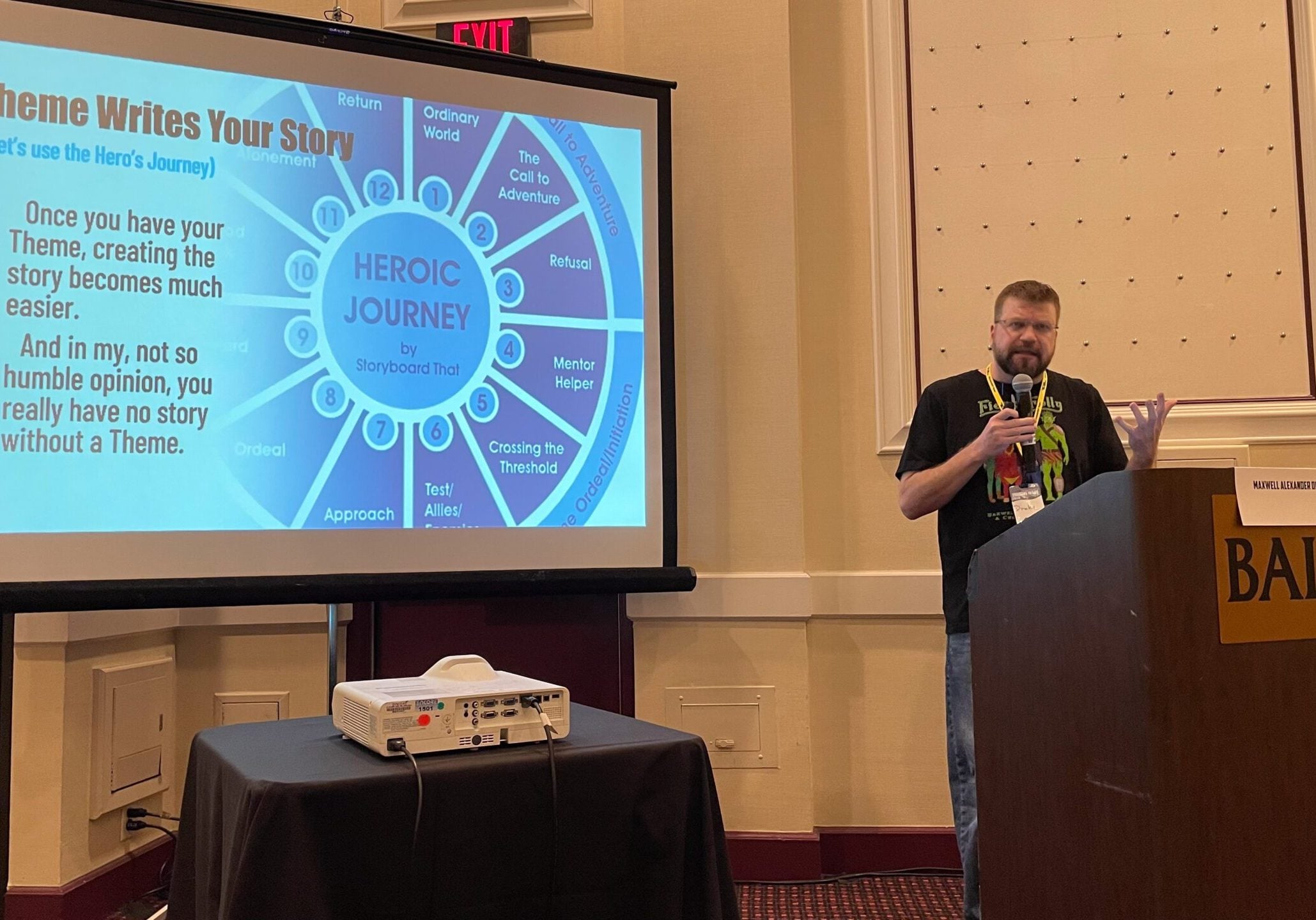 Maxwell Alexander Drake presenting on story theme at a conference